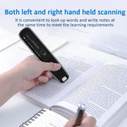 Person using handheld scanner to scan text in book while writing notes in notebook on white desk