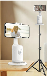 AI face tracking phone holder on wooden table and mounted on black adjustable tripod stand