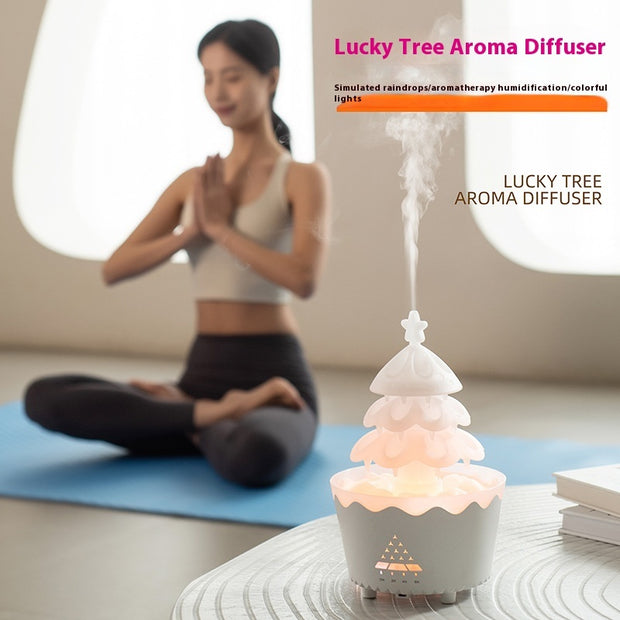 Lucky Tree Aroma Diffuser emitting steam in a calm yoga room with a woman meditating on a blue mat