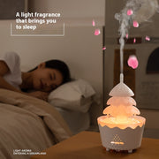 White aroma diffuser emitting mist with floating pink petals next to sleeping woman in cozy bedroom