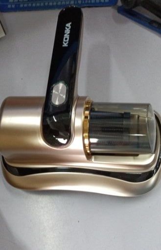 Konka electric handheld vacuum cleaner with gold and black design on white surface