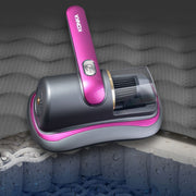 Konka handheld cordless vacuum cleaner with pink and grey design on textured surface