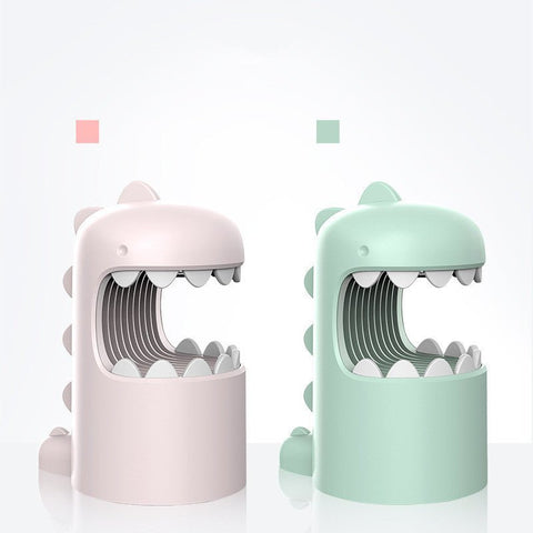 Cute dinosaur-shaped anti-mosquito lamps in pastel pink and green on white background