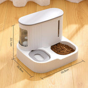 White automatic pet feeder and drinking fountain with kibble compartment on wooden floor