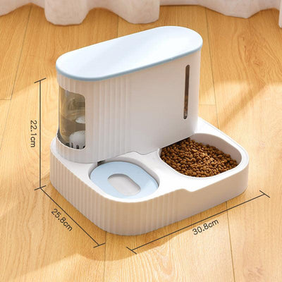 Automatic pet feeder and drinking fountain in white with water reservoir and dry food compartment on wooden floor