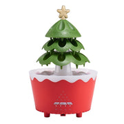 Red and white Christmas tree-shaped essential oil diffuser with green 3-tier tree and golden star topper