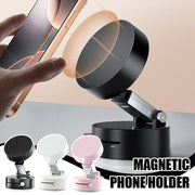 Magnetic foldable phone holder in black, white, and pink with a hand holding a phone near the holder