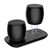 Portable black wireless Bluetooth speakers on a charging dock with one speaker floating, displaying electric charging effect