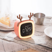 Digital desk clock with temperature display and reindeer antler design on striped fabric