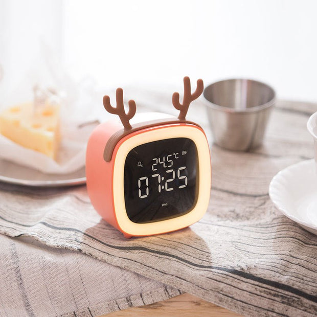 Digital desk clock with temperature display and reindeer antler design on striped fabric