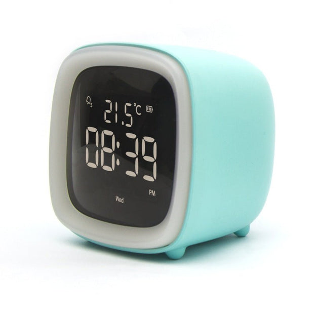 Digital desk clock with thermostat displaying time 08:39 PM and temperature 21.5°C in light blue case