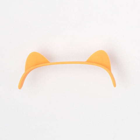 Orange cat ear-shaped plastic headband on white background