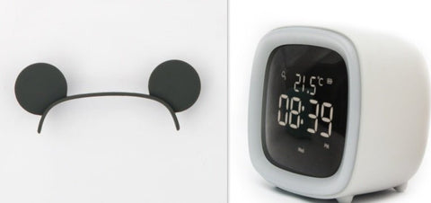 Digital desk clock with thermostat display showing 21.5°C and time 08:39 PM in white casing on white background
