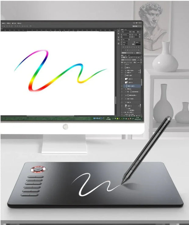 Digital drawing tablet with stylus pen creating white and rainbow brush strokes on a computer screen