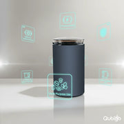 Modern electric grinder with dark cylindrical body and clear lid on reflective white surface