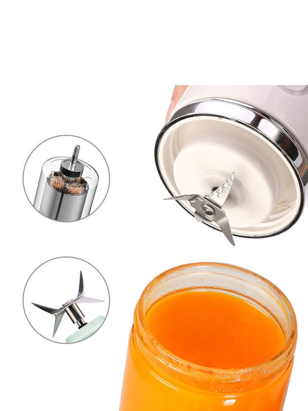 Electric portable juicer blade and motor close-up with fresh orange juice in a glass jar