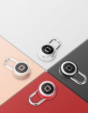 Four fingerprint biometric padlocks in silver, black, and red on multicolor background