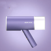 Purple and white foldable handheld garment steamer with AUX branding on purple background