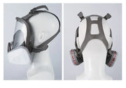 Side and back views of a full face gas mask with clear visor and dual filter cartridges on mannequin head