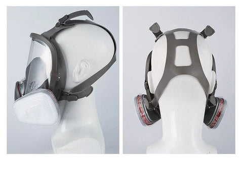 Side and back views of a full face gas mask with clear visor and dual filter cartridges on mannequin head