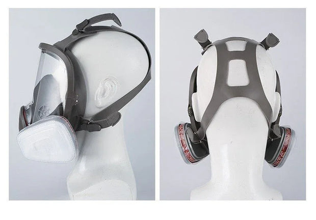 Side and back views of a full face gas mask with clear visor and dual filter cartridges on mannequin head