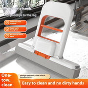 Handheld mini mop with white and orange handle on a kitchen sink with soap suds, easy to clean