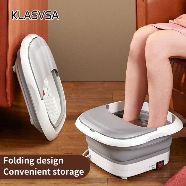 Person using foldable white electric foot bath massager on wooden floor near brown sofa