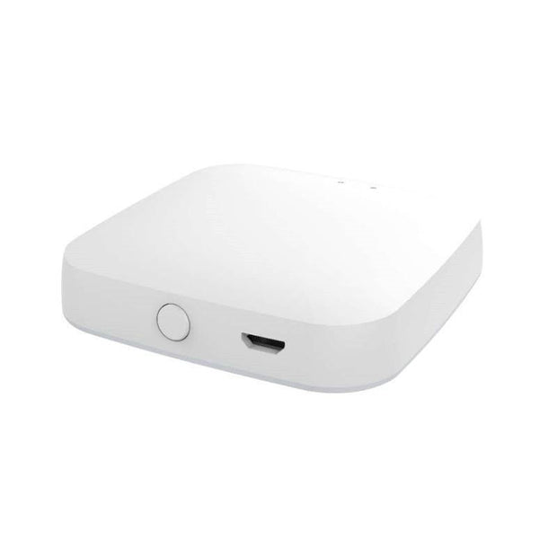 White smart home hub device with round button and USB port on side