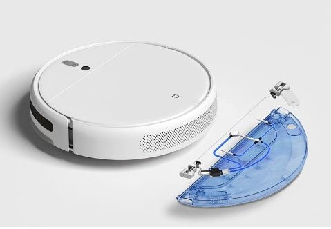 White intelligent sweeping robot vacuum with detachable transparent blue water tank on gray surface