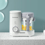 Boboduck multifunctional baby food machine with timer and container holding chopped yellow fruit