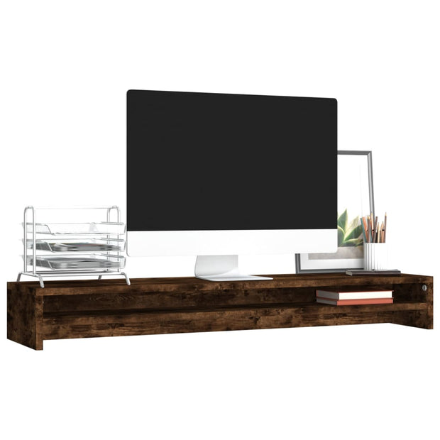 smoked oak wooden monitor stand with desktop computer, metal file organizer, framed plant art, and pencils