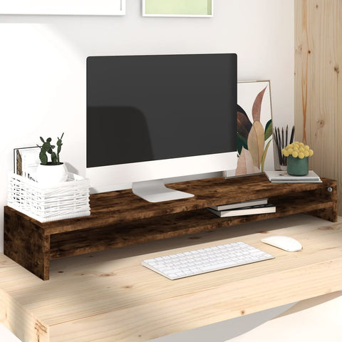 Smoked oak wooden monitor stand on light desk with computer, keyboard, mouse, and decorative plants