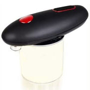 Black and red electric can opener on a white background for kitchen use