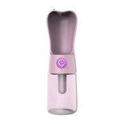Portable pink pet water bottle with built-in bowl and paw print button for dogs and cats
