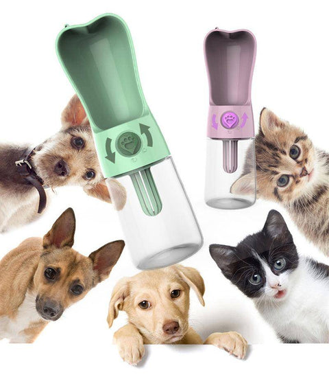 Portable pet water bottles with green and pink dispensers surrounded by curious dogs and cats