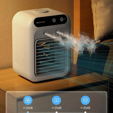 Compact white mini air cooler on wooden table emitting cool mist in cozy room