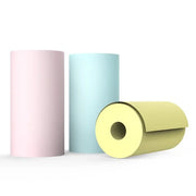 Three thermal paper rolls in pink, blue, and yellow used for portable Bluetooth printers