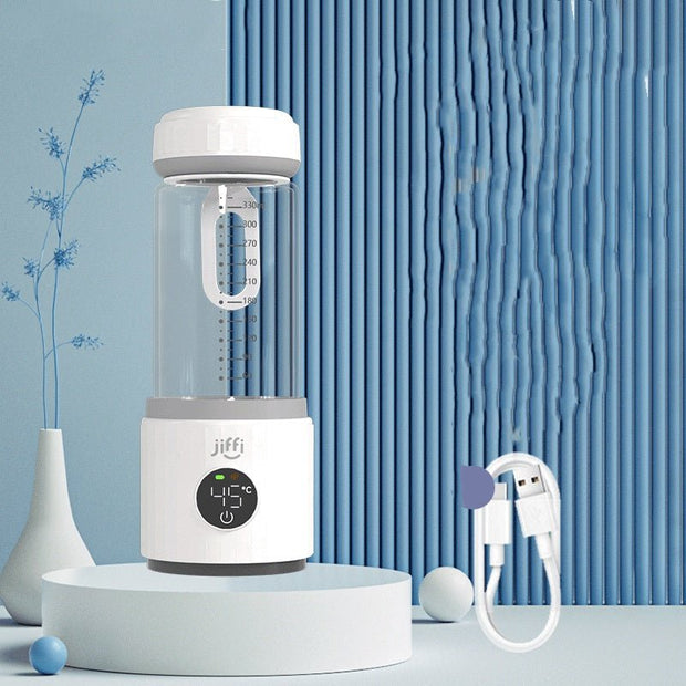 Jiffi portable milk temperature regulator with digital display and USB charging cable on blue decorative background
