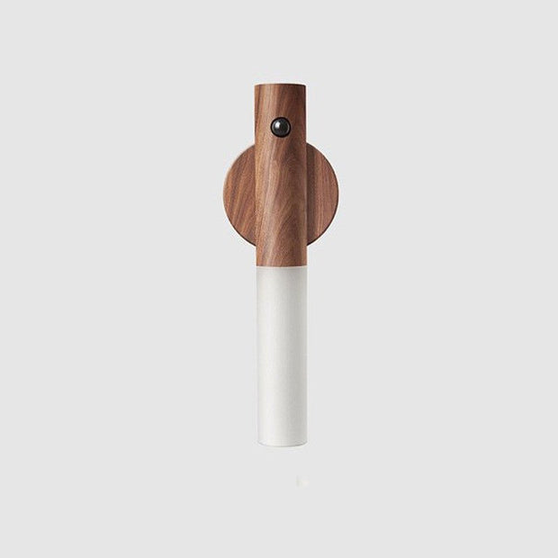Minimalist wooden wall lamp with cylindrical white light diffuser and black sensor