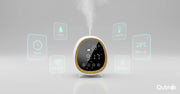 Smart aroma diffuser with digital clock, temperature display, and mist output, surrounded by feature icons