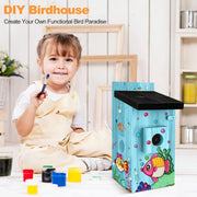 Child painting colorful DIY wooden birdhouse with marine fish designs in bright indoor craft space