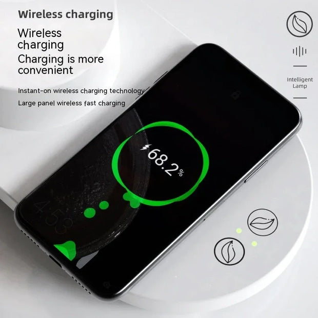 Smart wireless charging speaker lamp with black smartphone showing 68.2% battery on white surface