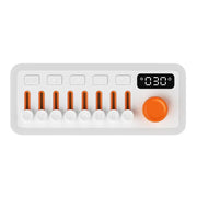 white smart sleeping speaker with orange sliders, buttons, and digital timer display on top