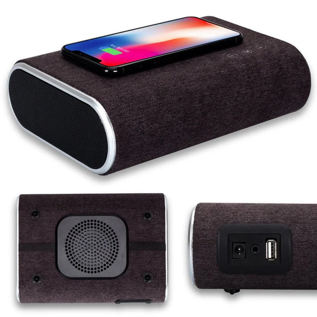 Multi-angle view of wireless charger speaker with black fabric finish, smartphone charging on top, USB and audio ports