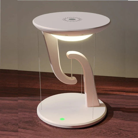 modern wireless floating charger with white circular design and glowing light on wooden surface