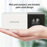 Mini white and black palm-sized projector held in one hand with text 'Mini and compact, one handed, palm sized design'